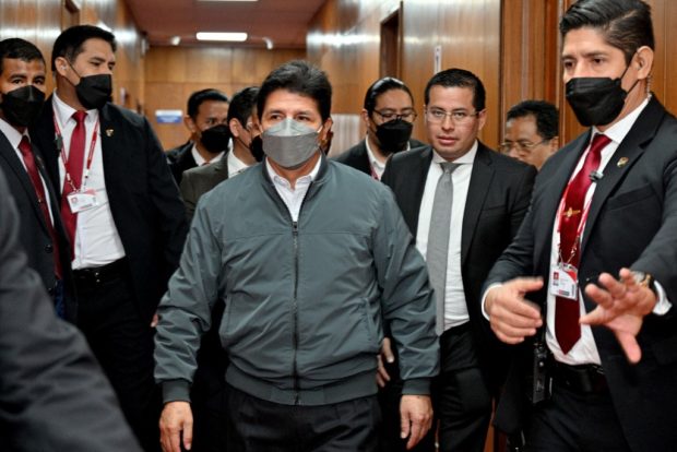 Handout picture released by the Peruvian Public Prosecutors office of President Pedro Castillo arriving to the prosecutor's office in Lima on August 3, 2022.