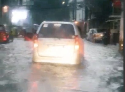 A gutter deep-flood fills Nakpil Street in Manila after thunderstorms hit the area. Screengrab from video of Eloisa Behan via Manila Public Information Office