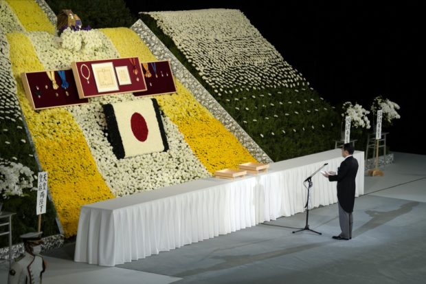 Japans Prime Minister Fumio Kishida delivers his condolences during the state funeral of assassinated former Japanese prime minister Shinzo Abe at Nippon Budokan in Tokyo on September 27, 2022. (Photo by Eugene Hoshiko / POOL / AFP)