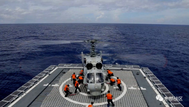 A Navy Force helicopter under the Eastern Theatre Command of China's People's Liberation Army (PLA) takes part in military exercises in the waters around Taiwan, at an undisclosed location August 8, 2022 in this handout picture released on August 9, 2022. Eastern Theatre Command/Handout via REUTERS