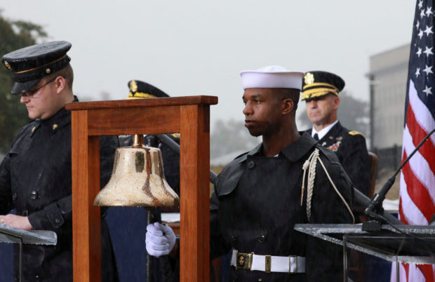 A bell is rung during a ceremony to honor victims of the September 11, 2001, attacks at the Pentagon in Washington, U.S., September 11, 2022. REUTERS/Cheriss May