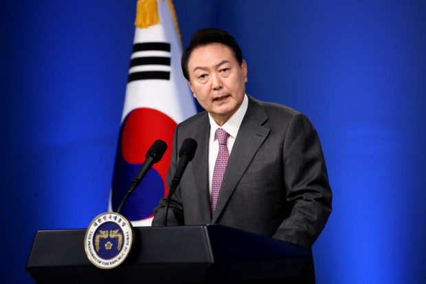 FILE PHOTO: South Korea's President Yoon Suk-yeol holds first official news conference, after taking office in May, to mark 100 days in office, in Seoul, South Korea August 17, 2022. Chung Sung-Jun/Pool via REUTERS/File Photo