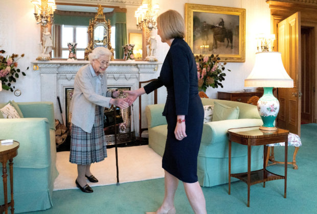 FILE PHOTO: Queen Elizabeth welcomes Liz Truss during an audience where she invited the newly elected leader of the Conservative party to become Prime Minister and form a new government, at Balmoral Castle, Scotland, Britain September 6, 2022. Jane Barlow/Pool via REUTERS/File Photo