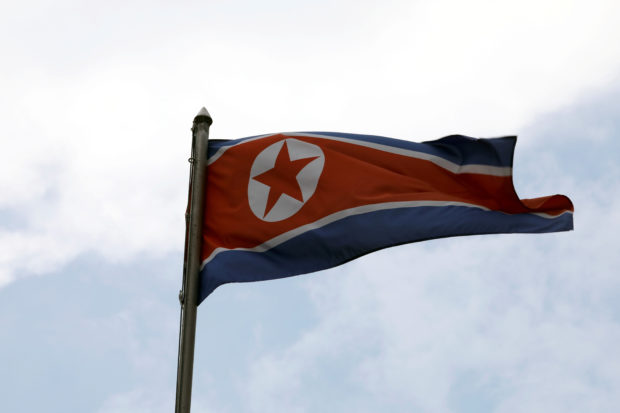 The photo shows the flag of North Korea where new propaganda posters featuring its nuclear-tipped ballistic missiles have been released.