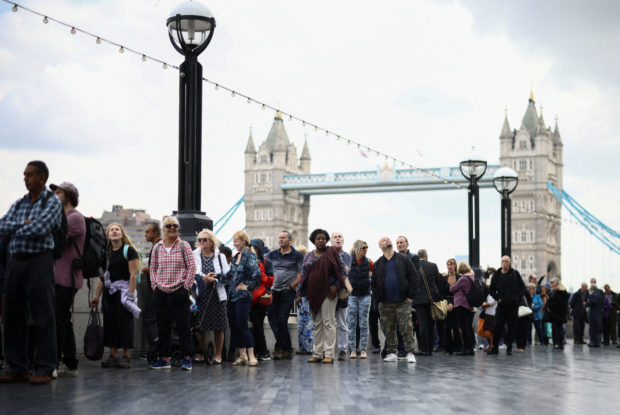People queue near Tower Bridge to pay their respects, following the death of Britain's Queen Elizabeth, in London, Britain, September 15, 2022. REUTERS/Henry Nicholls