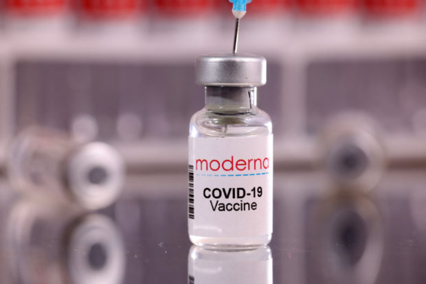 FILE PHOTO: A vial labelled "Moderna COVID-19 Vaccine" is seen in this illustration taken January 16, 2022. REUTERS/Dado Ruvic/Illustration