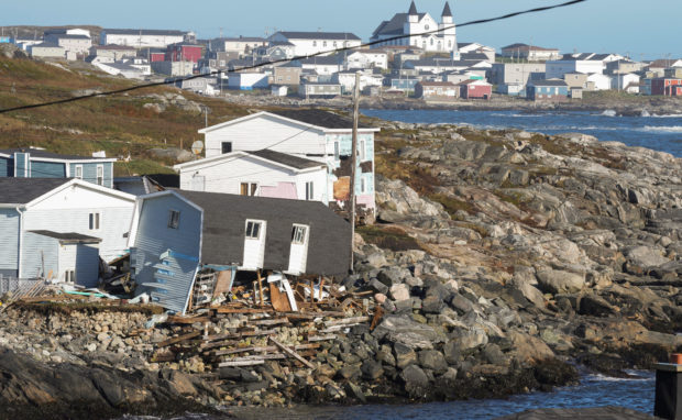 FILE PHOTO: A damaged building is seen in the aftermath of Hurricane Fiona in Port Aux Basques, Newfoundland, Canada September 25, 2022. REUTERS/John Morris