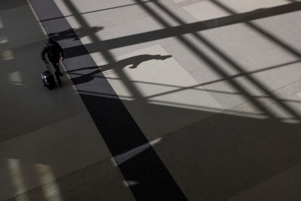 FILE PHOTO: A passenger walks along terminal 2 at the San Francisco International Airport in San Francisco, California , U.S., September 3, 2022. REUTERS/Carlos Barria/File Photo