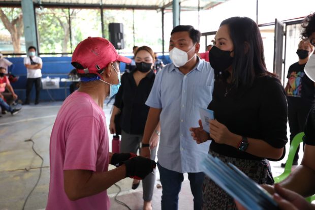 Quezon City Mayor Joy Belmonte distributing fuel vouchers to tricycle drivers and operators. STORY: QC gives fuel subsidy to 556 tricycle drivers, operators