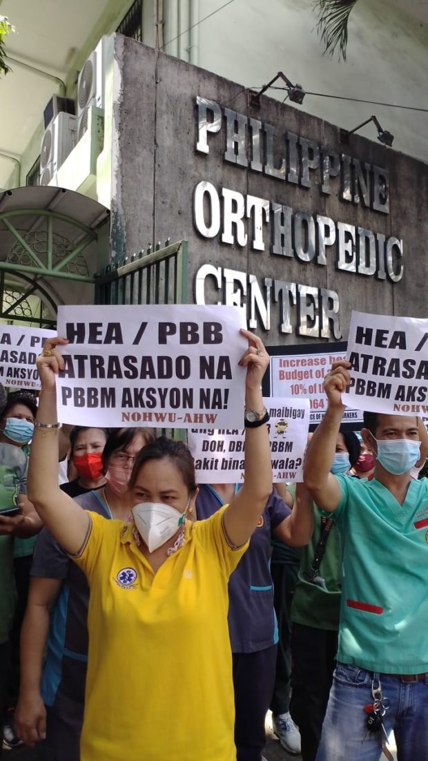 AHW members hold a noise barrage at the Philippine Orthopedic Center to register their protest against the non-payment of their COVID-19 benefits.