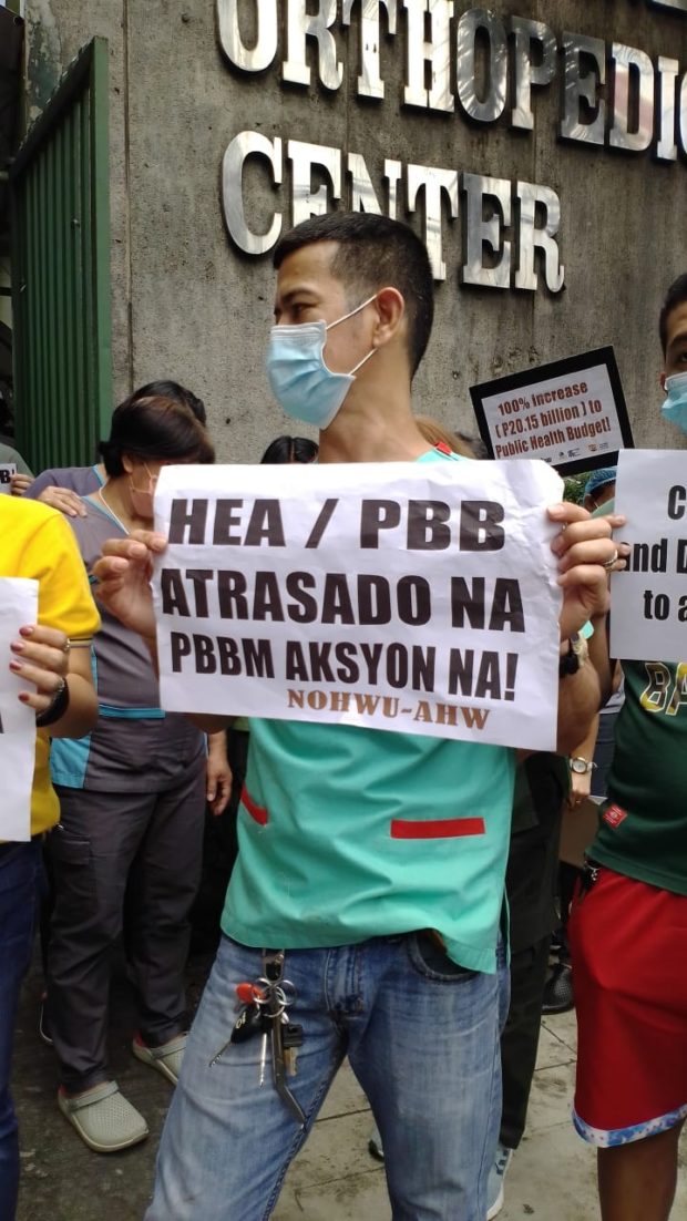 AHW members hold a noise barrage at the Philippine Orthopedic Center to register their protest against the non-payment of their COVID-19 benefits.