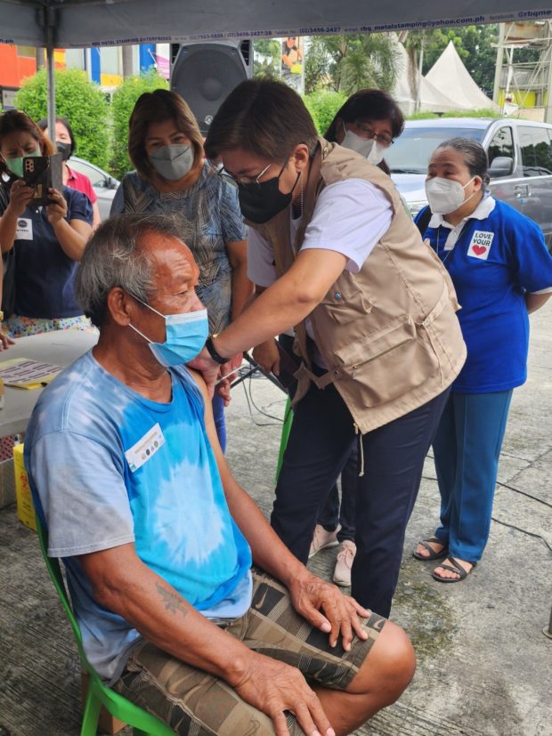 The Department of Health officer-in-charge Maria Rosario Vergeire led a vaccination initiative for homeless families in Scout Santiago, Quezon City on Thursday.