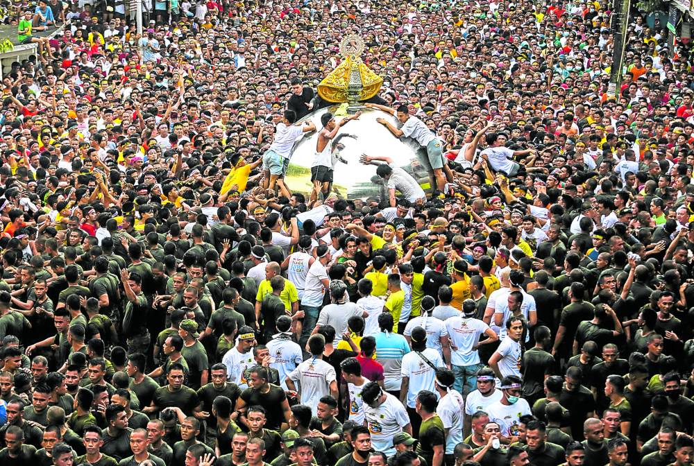 Thousands of devotees join Friday’s “traslacion” procession of Our Lady of Peñafrancia in Naga City