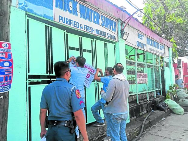 CLOSED Personnel of the Iloilo City government, accompanied by policemen, closed on Sept. 8 some water refilling stations noncompliant with sanitary rules amid the rise of acute gastroenteritis cases in the city. FOR STORY: In Iloilo, severe gastroenteritis cases now over 500
