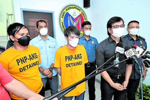  Interior Secretary Benhur Abalos (second from right) presents Malaysian national Chan Yong Howe (third from left) and his Filipino accomplice Justine Alaraz. STORY: 3rd crime involving Malaysians