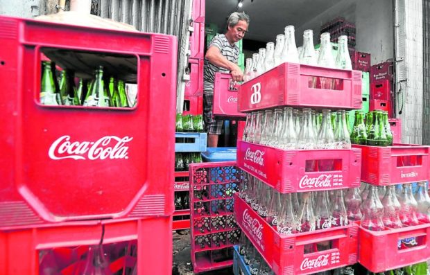  A worker arranges cases of empty bottles at a warehouse in Makati City as Coca-Cola Philippines closed its plants in Bohol and Iloilo STORY: Coca-Cola shuts down plants in Bohol, Iloilo STORY: Coca-Cola temporarily shuts down plants in Bohol, Iloilo
