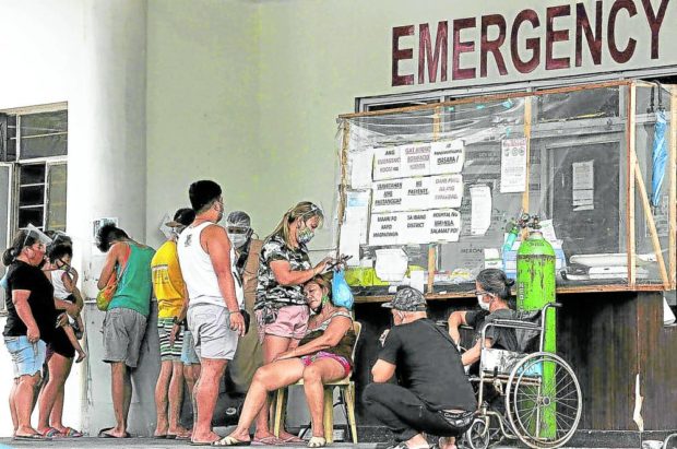 Patients outside the emergency room of the Andres Bonifacio Memorial Medical Center in Manila. STORY: COVID-19 drops out of top 10 causes of death in PH