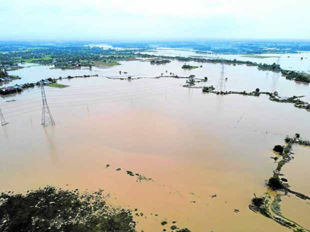 DESTROYED CROPS Farmers in Luzon provinces hit by Typhoon “Karding” (Noru) will need assistance from the government so they can recover their losses. On Monday, agricultural areas in San Miguel, Bulacan, remain flooded due to heavy rain dumped by Karding. —GRIG C. MONTEGRANDE