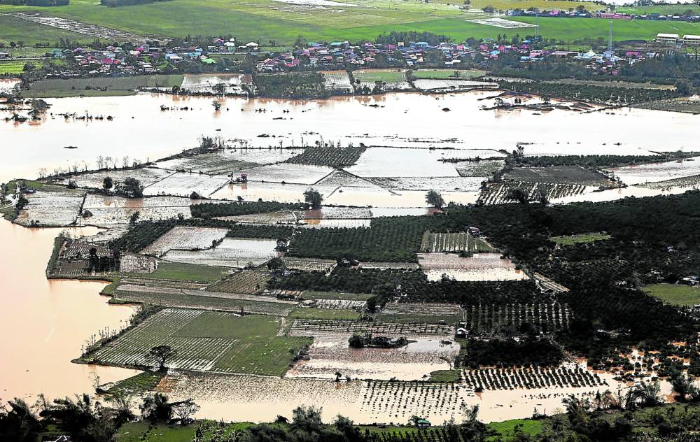 Vast tracts of farms are submerged by flood