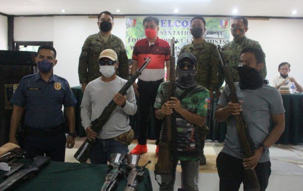 BIFF fighters turn over their firearms to local and military officials in Maguindanao. (Army photo)