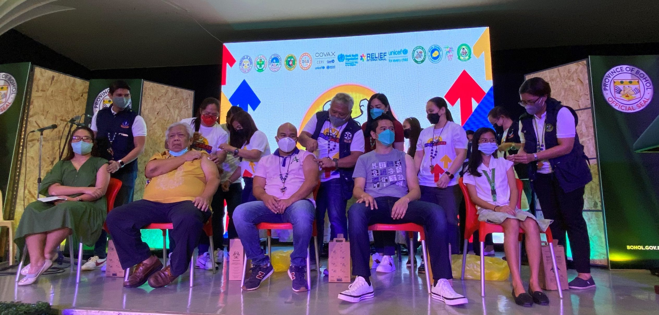 Bohol officials receive their COVID-19 booster shots during the launching of the "PinasLakas" booster vaccination drive