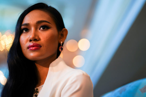 Han Lay, Miss Grand Myanmar looks on during an interview with Reuters in Bangkok, Thailand, April 2, 2021. REUTERS/Athit Perawongmetha/