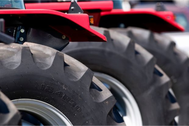 Stock photo closeup of farm tractors wheels. STORY: 1,346 farm tractors found to be ‘overpriced’