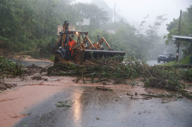 The death toll from Tropical Storm Julia rose to at least 16 on Monday, officials said, with most victims coming from El Salvador and Honduras.