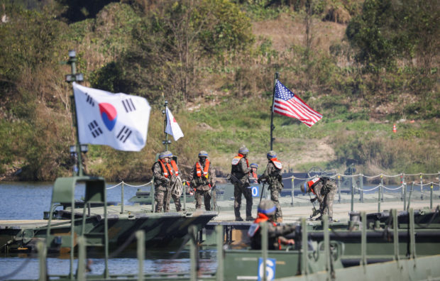 South Korean and American troops practiced building floating bridges to ferry tanks and other armored vehicles across rivers on Wednesday