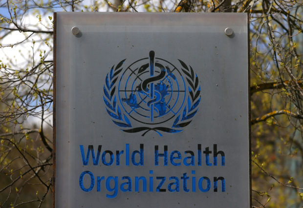 A logo is pictured outside a building of the World Health Organization (WHO) during an executive board meeting on update on the coronavirus disease (COVID-19) outbreak, in Geneva, Switzerland, April 6, 2021. REUTERS/Denis Balibouse/File Phot