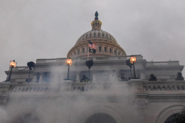 Police clear the U.S. Capitol Building with tear gas as supporters of U.S. President Donald Trump gather outside, in Washington, U.S. January 6, 2021. REUTERS/Stephanie Keith/File Photo