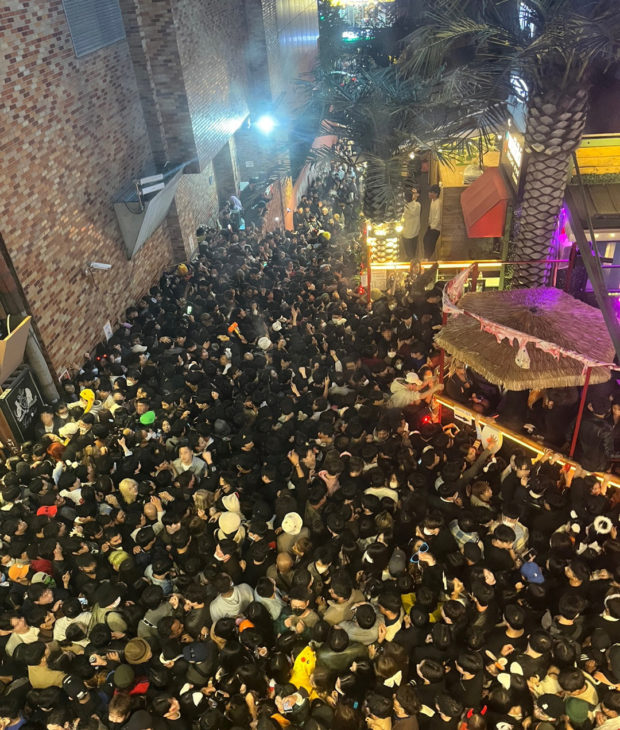 A street in Itaewon district is pictured full of people before a stampede during Halloween festivities killed and injured many in Seoul, South Korea, in this image released by Yonhap on October 30, 2022. Yonhap via