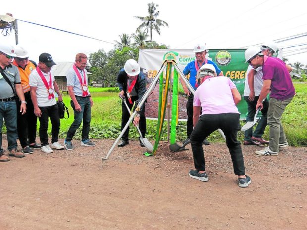 GETTING GOVERNMENT'S SUPPORT Officials of the Department of Agrarian Reform and other agencies launch a road-concreting project in Trento, Agusan del Sur which, when completed, will help the Sempco farmers' cooperative bring their cheap rice to more public markets. PHOTO CONTRIBUTED