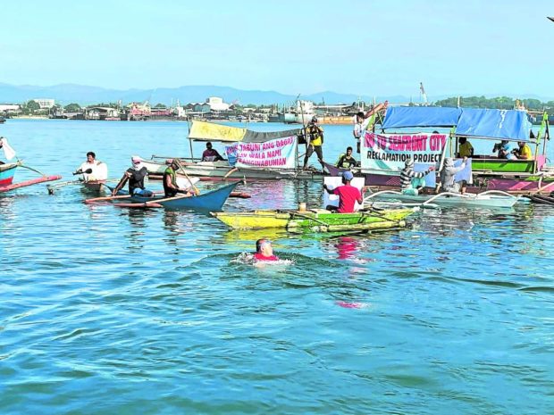 PROTECTING FISHING GROUND Fishermen in Consolacion, Cebu, and their supporters hold a fluvial parade in October 2021 to oppose a reclamation project backed by the local government, which they say will destroy their fishing grounds. STORY: Cebu town reclamation hits another snag