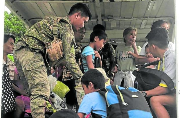 In Negros Occidental, residents displaced by the clash between government soldiers and communist rebels return home.