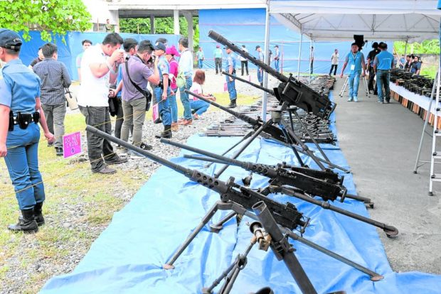 DECOMMISSIONED Authorities place on display the surrendered weapons of former Moro Islamic Liberation Front rebels that were deactivated during the Phase 2 decommissioning ceremony in September 2019. —BONG S. SARMIENTO. STORY: MILF laments ex-Moro rebels not getting promised benefits