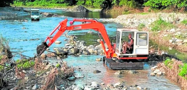 UNAUTHORIZED ACTIVITIES Screenshot of drone footage shows British national Neil Short operating a backhoe at the Lanatin River. STORY: Private project on Tanay river alarms locals; DENR steps in