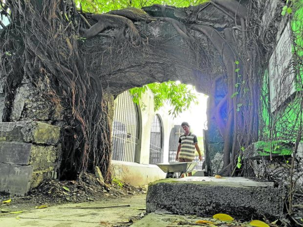 This centuries-old entrance arch at the Nuestra Señora de la Asuncion Parish public cemetery in Bulakan town, Bulacan, separates the gravesites of personalities from ordinary citizens of the town