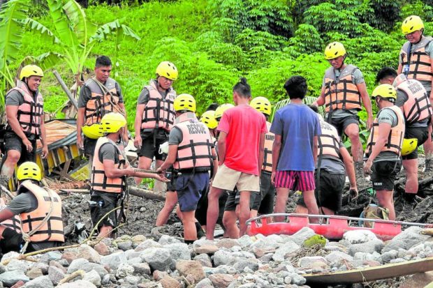 Rescuers dig among mud and rocks near a river as they try to search for bodies of victims of a landslide in Kusiong village which lies at the foot of Mt. Mindanar in Datu Odin Sinsuat, Maguindanao. STORY: Over 100 homes buried, but rescuers fail to find bodies