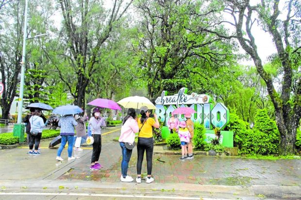 Despite the howling winds and rains spawned by Severe Tropical Storm “Paeng” (international name: Nalgae), some weekend tourists still turn up and wander around Burnham Park on Sunday. Tourism is a key economic driver in the summer capital that has since seen a rise in mixed-use real estate development projects mostly initiated by local builders. STORY: Developers step up to help with Cordillera economic recovery