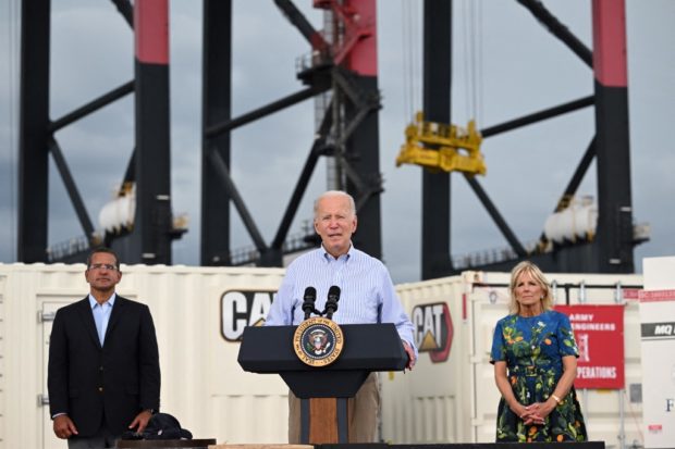 US President Joe Biden, flanked by First Lady Jill Biden and Puerto Rico Governor Pedro Pierluisi, delivers remarks in the aftermath of Hurricane Fiona in Ponce, Puerto Rico, on October 3, 2022. - Biden flew to Puerto Rico on Monday to inspect storm damage, saying in a veiled jab at his predecessor Donald Trump that the territory had not "been taken very good care of" during a crippling series of past hurricanes. (Photo by SAUL LOEB / AFP)