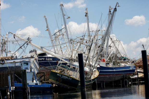 Stranded shrimp boats are seen in the Matanzas Pass after Hurricane Ian caused widespread destruction in Fort Myers Beach, Florida, U.S., October 1, 2022. REUTERS/Marco Bello