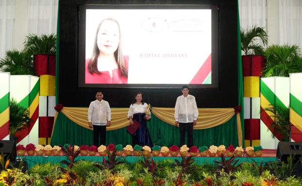 Javellana receives The Outstanding UPLB Alumni Award (TOUAA) from UPLB Chancellor Dr. Jose V. Camacho Jr. and Capt. Mauro W. Barradas, UPLBAA president. Photo by Christopher Labe/UPLB Office of Public Relations