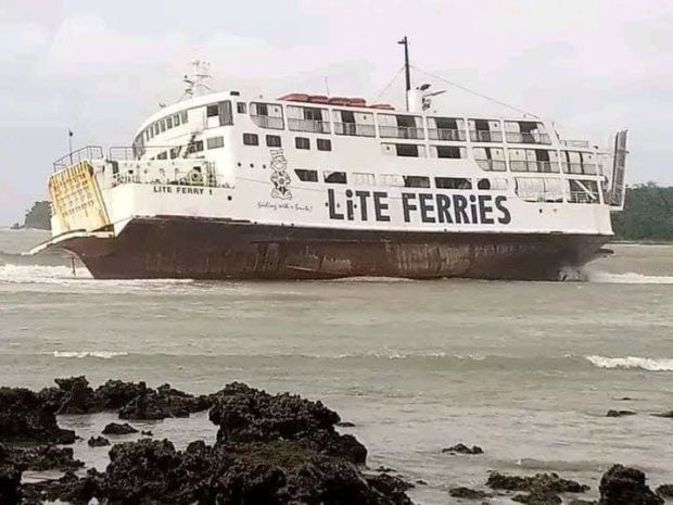 Passenger vessel MV Lite Ferry 1 tilts on its side after it ran aground at the Jagna Port in Bohol amid the strong winds spawned by tropical storm “Paeng.” Photo courtesy of Coast Guard Station Eastern Bohol 