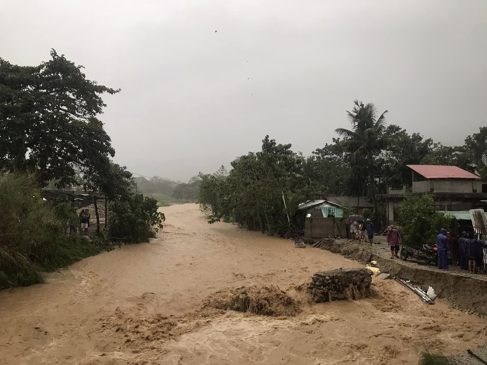 The Mapaco Creek in Pancian village in Pagudpud swells and overflows due to shear line-induced rains 