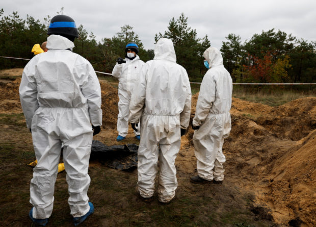 Ukraine exhumes dozens of bodies