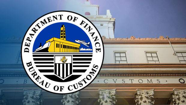 Logo of Bureau of Customs over BOC building facade. STORY: P20-M carrots, onions seized in Subic