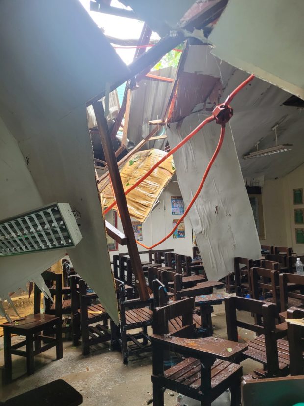 Toppled trees due to strong winds caused by Severe Tropical Storm "Paeng" damaged the roof of a classroom in Olongapo City (Photo courtesy of Kagawad John Tagulao Cruz) 