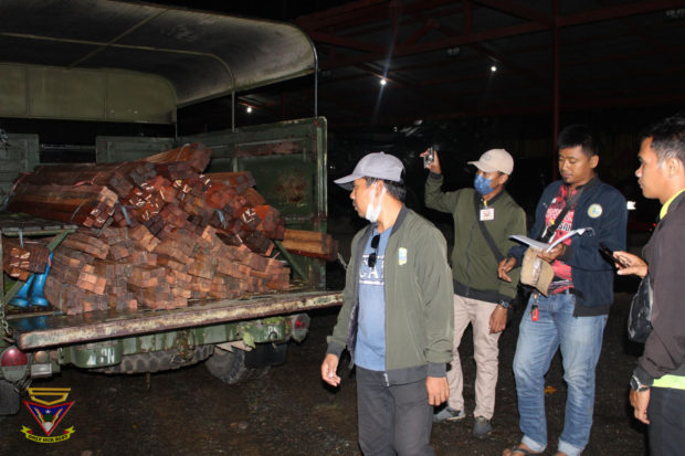 BARMM environment personnel audit seized Lauan lumber abandoned in an illegal sawmill in Barangay Nabalawag, Barira, Maguindanao