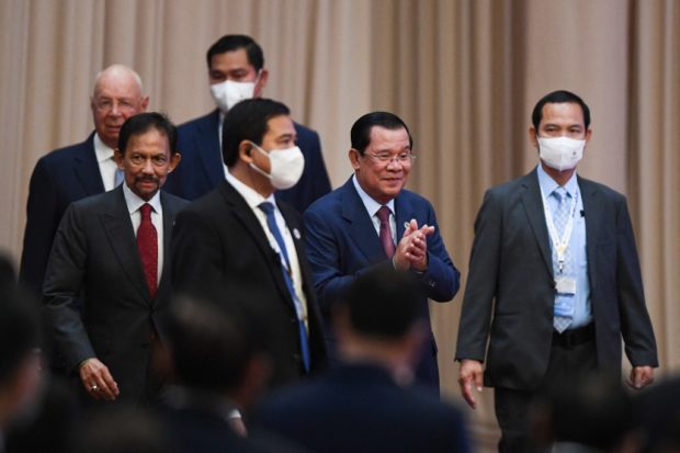 Sultan of Brunei Hassanal Bolkiah (front L) and Cambodia's Prime Minister Hun Sen (2nd R) arrive for the opening ceremony of the 40th and 41st Association of Southeast Asian Nations (ASEAN) Summits in Phnom Penh on November 11, 2022. (Photo by Nhac NGUYEN / AFP)